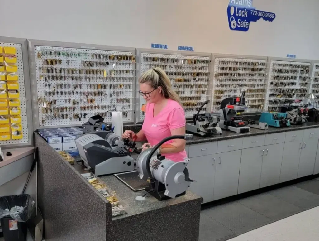 Adams Lock & Safe shop interior with employee at counter